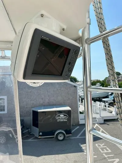 Tuna Daze Yacht Photos Pics Boat navigation system on a 2004 Cabo Express, dockside view in the background.