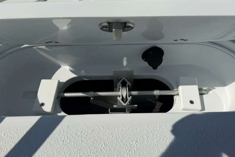  Yacht Photos Pics Open compartment of 2025 Yellowfin 26 Hybrid boat, showcasing interior mechanism.