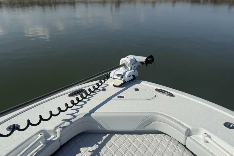  Yacht Photos Pics 2025 Yellowfin 26 Hybrid boat bow with trolling motor on calm water.