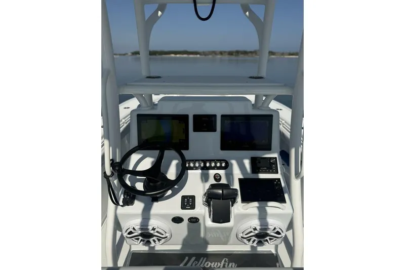  Yacht Photos Pics 2025 Yellowfin 26 Hybrid boat dashboard with steering wheel and electronic displays.