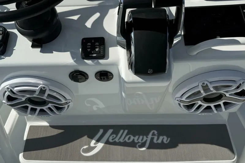  Yacht Photos Pics 2025 Yellowfin 26 Hybrid boat dashboard with controls and speakers.
