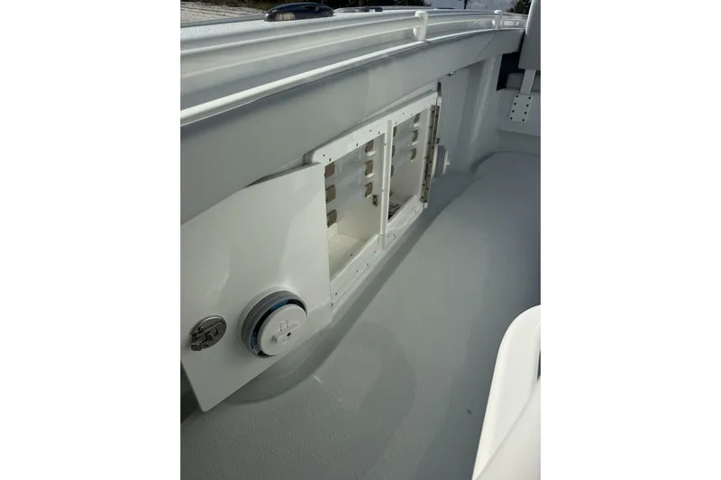  Yacht Photos Pics 2025 Yellowfin 26 Hybrid boat interior with storage compartment and control panel.