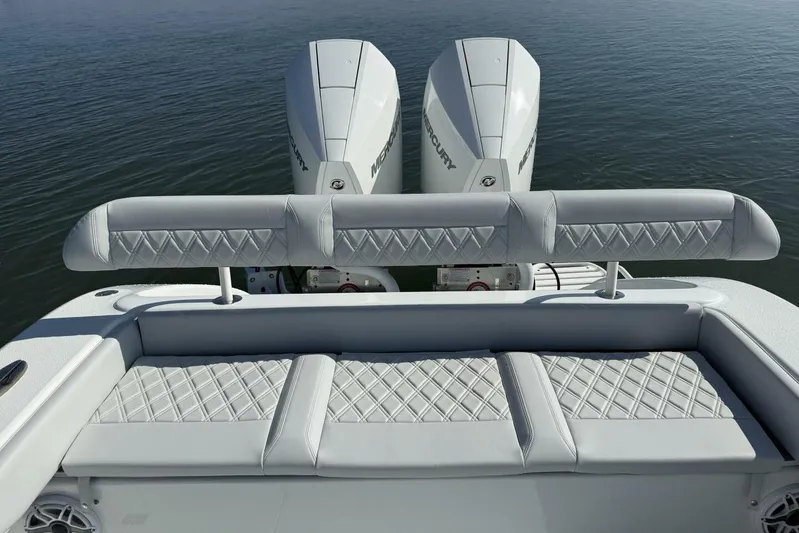  Yacht Photos Pics 2025 Yellowfin 26 Hybrid boat with dual Mercury engines and cushioned seating.