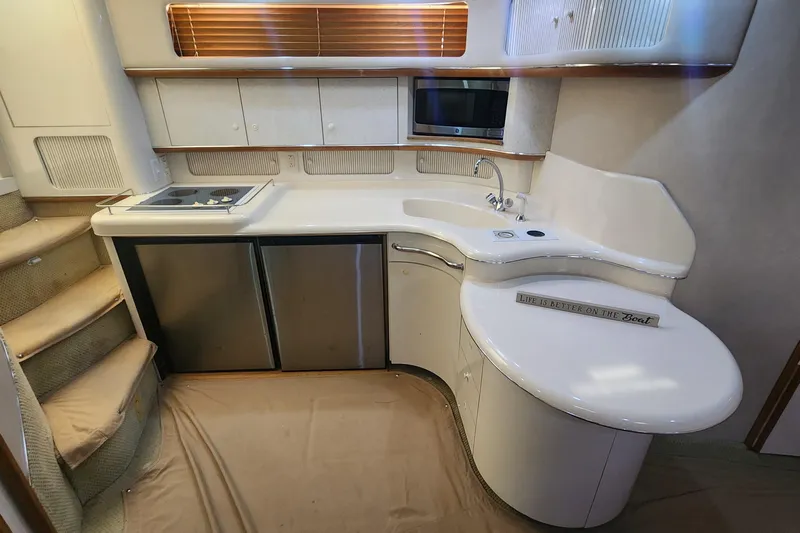 Lemaar Yacht Photos Pics Interior of 1995 Sea Ray 450 Sundancer yacht kitchen with modern amenities.