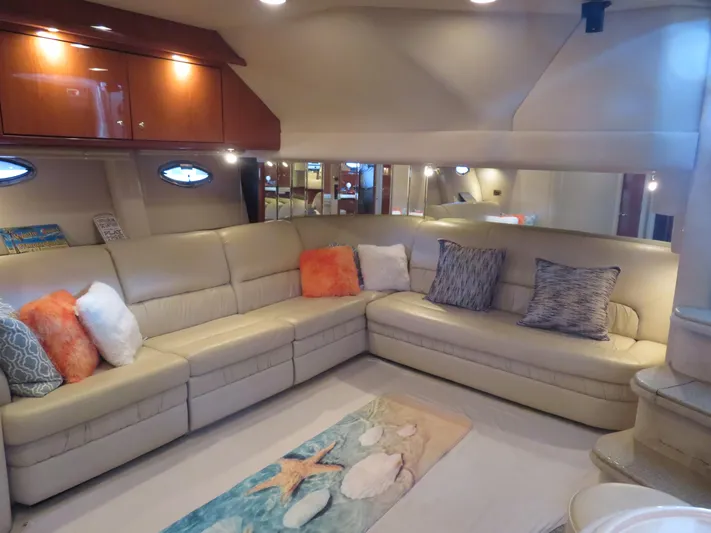  Yacht Photos Pics Luxurious interior of 2001 Sea Ray 510DA yacht with plush seating and decorative pillows.