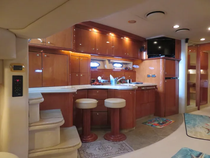  Yacht Photos Pics Luxurious interior of 2001 Sea Ray 510DA yacht with modern kitchen and seating area.