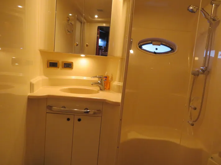  Yacht Photos Pics Luxurious bathroom in a 2001 Sea Ray 510DA yacht with shower and vanity.