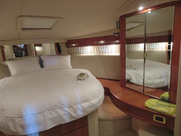  Yacht Photos Pics Luxurious bedroom interior of 2001 Sea Ray 510DA yacht with mirrored closet.