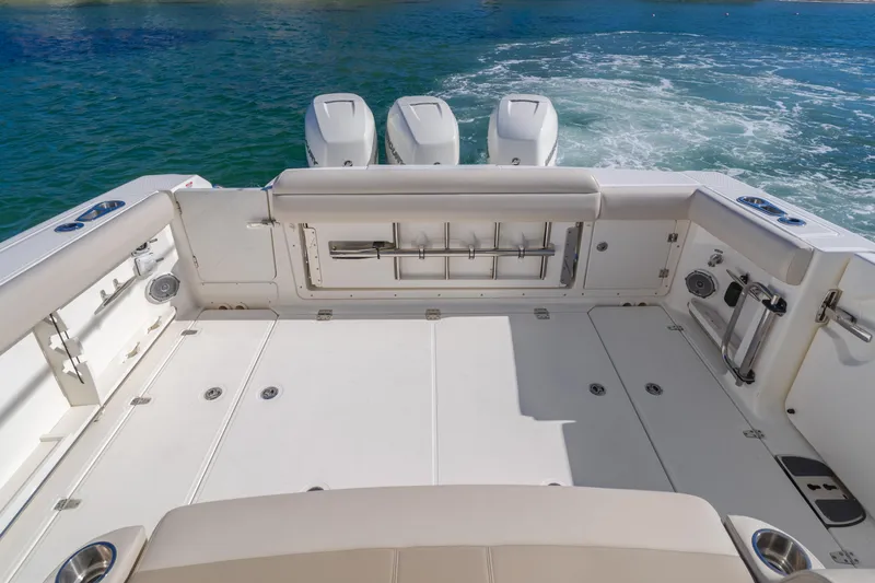Robin Ann Yacht Photos Pics 2018 Boston Whaler 380 Outrage boat deck with triple engines on water.