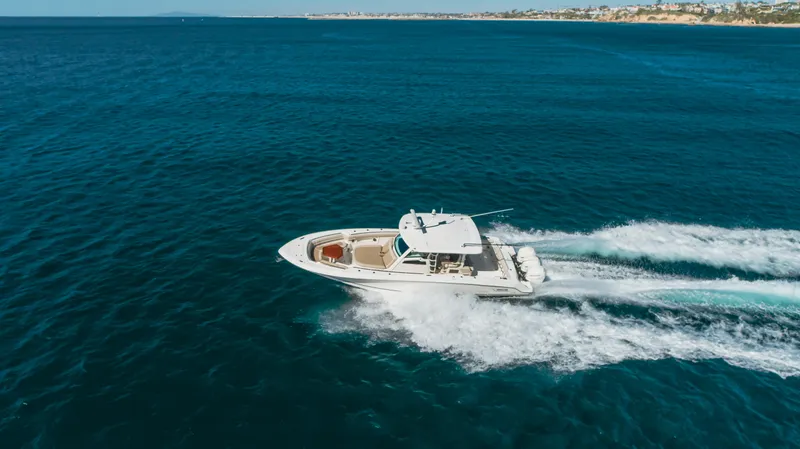 Robin Ann Yacht Photos Pics 2018 Boston Whaler 380 Outrage cruising on open blue water.