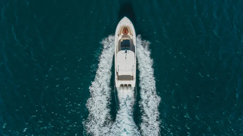 Robin Ann Yacht Photos Pics Aerial view of 2018 Boston Whaler 380 Outrage cruising on open water.