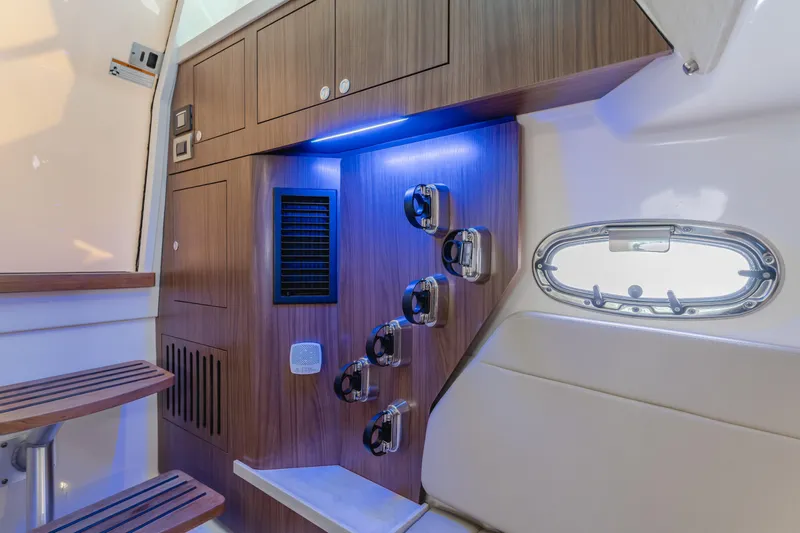 Robin Ann Yacht Photos Pics 2018 Boston Whaler 380 Outrage cabin interior with wood paneling and modern lighting.