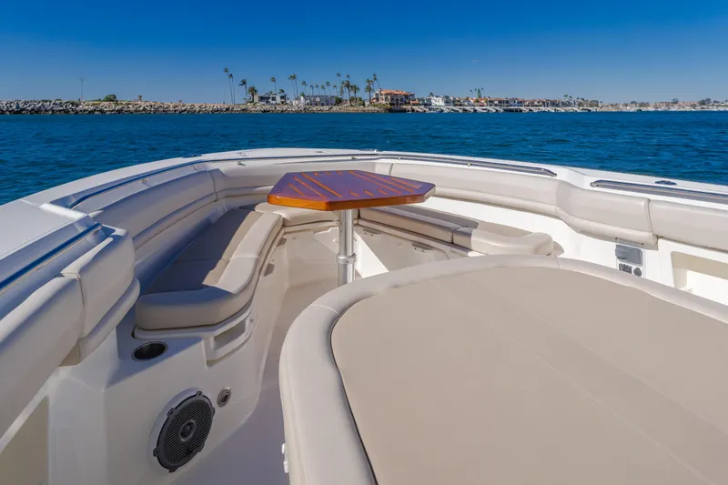 Robin Ann Yacht Photos Pics 2018 Boston Whaler 380 Outrage boat interior with seating and table, ocean view.