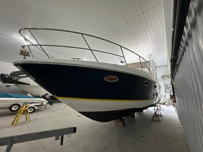  Yacht Photos Pics 2004 Regal Commodore 3860 yacht in indoor storage, side view.