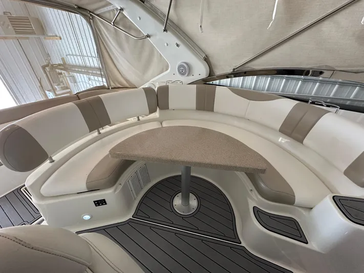  Yacht Photos Pics 2004 Regal Commodore 3860 interior with curved seating and table, featuring modern design elements.