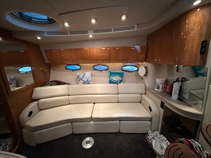  Yacht Photos Pics Luxurious interior of 2004 Regal Commodore 3860 yacht with plush seating and elegant wood finishes.