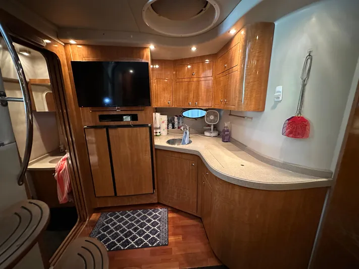  Yacht Photos Pics Luxurious 2004 Regal Commodore 3860 yacht interior with modern kitchen and entertainment area.