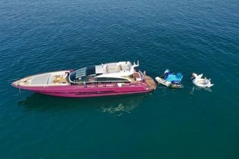 Argonaut Yacht Photos Pics Luxurious 2011 Baia ONE HUNDRED yacht on serene blue water with inflatable swan floats.