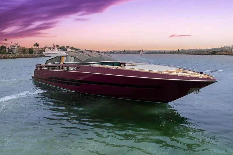 Argonaut Yacht Photos Pics Luxurious 2011 Baia xxx yacht cruising at sunset with vibrant sky.