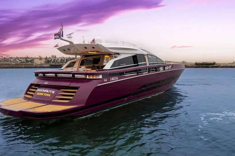 Argonaut Yacht Photos Pics Luxurious 2011 Baia yacht on serene water at sunset, showcasing sleek design and elegance.