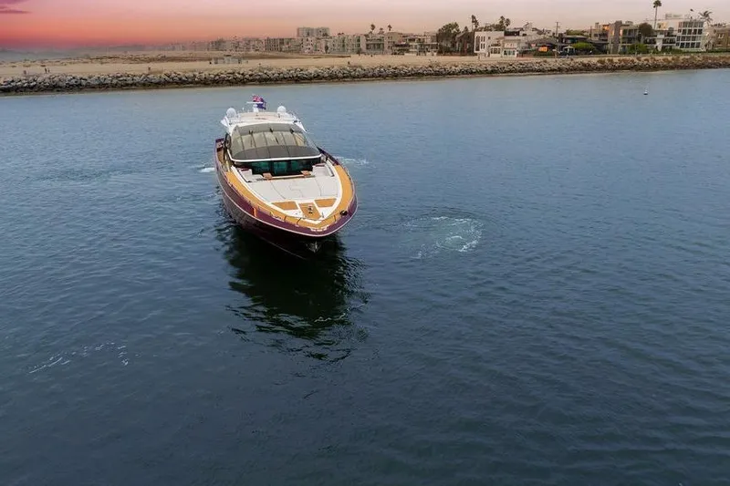 Argonaut Yacht Photos Pics Luxury Baia xxx yacht cruising near coastline at sunset, 2011 model.