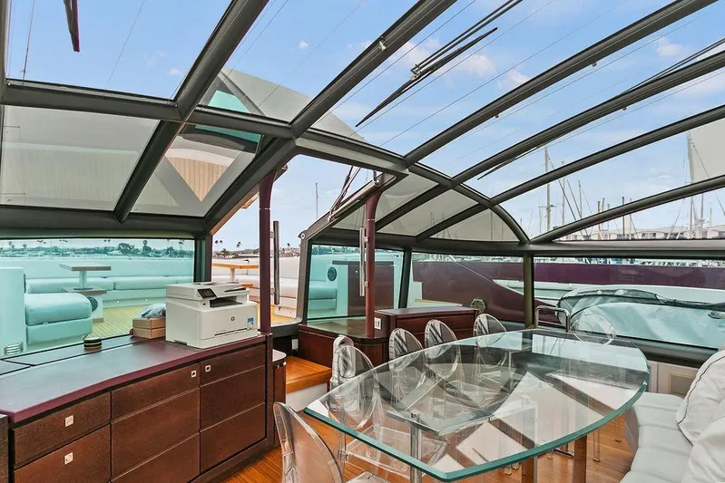 Argonaut Yacht Photos Pics Luxurious 2011 Baia yacht interior with glass dining table and panoramic windows.