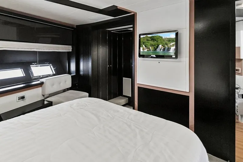 Argonaut Yacht Photos Pics Luxurious 2011 Baia yacht bedroom with modern decor and wall-mounted TV.
