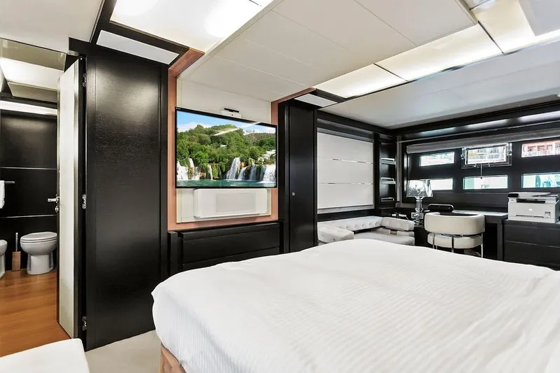 Argonaut Yacht Photos Pics Luxurious 2011 Baia yacht interior with modern bedroom, TV, and elegant furnishings.