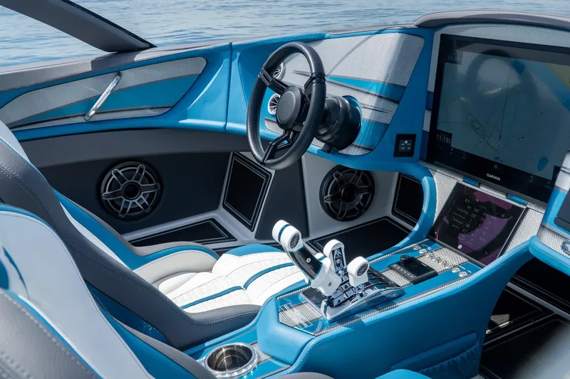  Yacht Photos Pics Luxurious 2024 MTI 440X boat interior with advanced navigation system and sleek blue design.