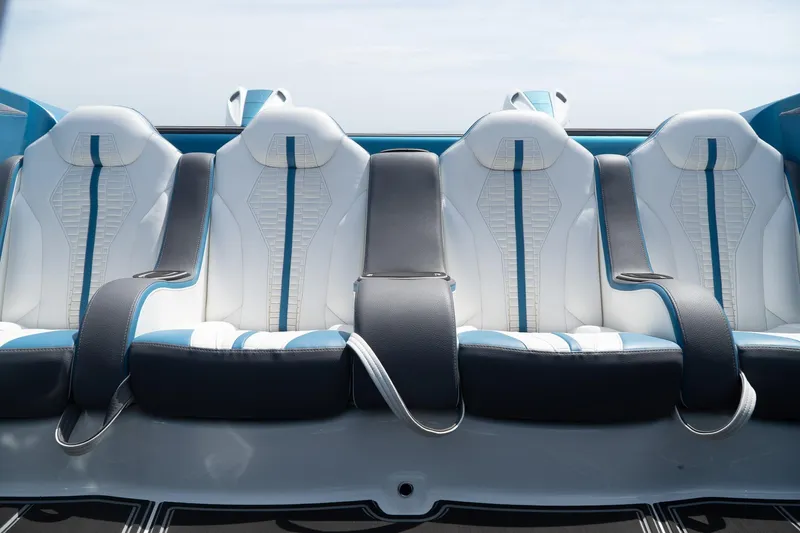  Yacht Photos Pics Luxurious 2024 MTI 440X interior with white and blue seating, modern design.