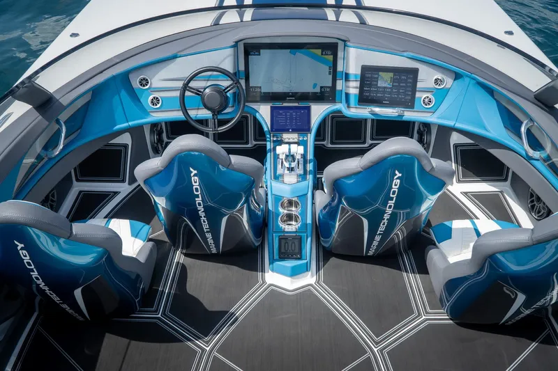  Yacht Photos Pics 2024 MTI 440X boat cockpit with advanced navigation screens and blue marine technology seats.