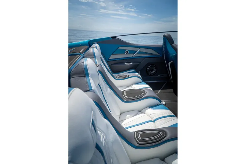  Yacht Photos Pics 2024 MTI 440X luxury boat interior with blue and white seating, ocean view.