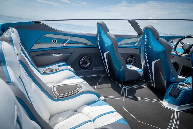  Yacht Photos Pics 2024 MTI 440X boat interior with blue and white seating, sleek design, and modern technology.
