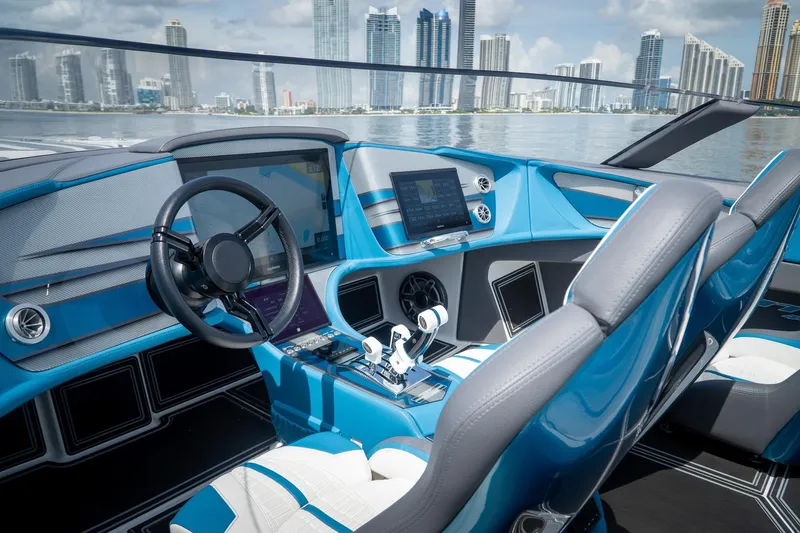  Yacht Photos Pics Interior of 2024 MTI 440X boat with modern dashboard and city skyline view.