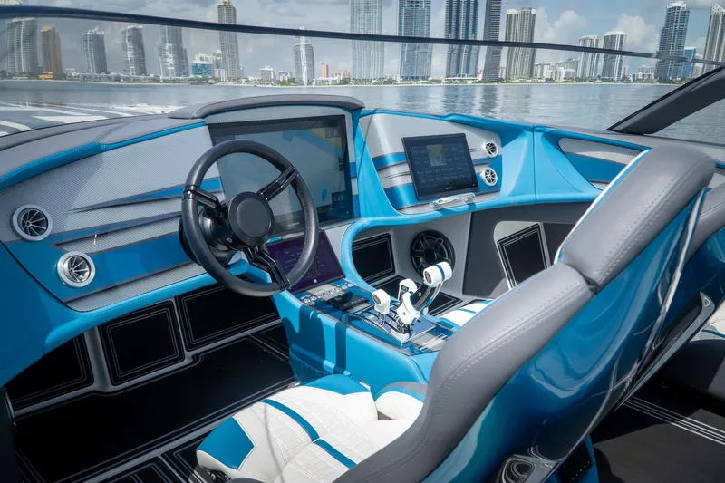  Yacht Photos Pics 2024 MTI 440X boat cockpit with modern controls and city skyline view.