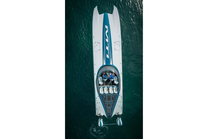  Yacht Photos Pics Top view of 2024 MTI 440X powerboat on water, showcasing sleek design and vibrant colors.