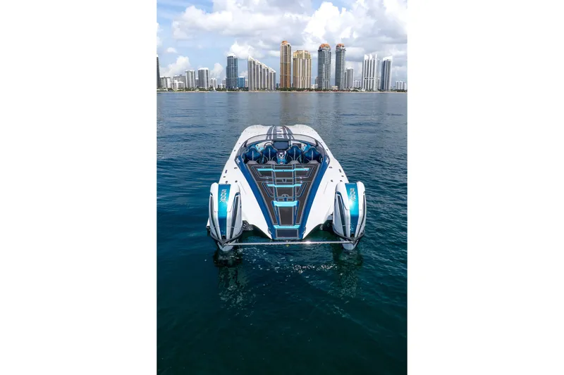  Yacht Photos Pics 2024 MTI 440X powerboat on water with city skyline in background.