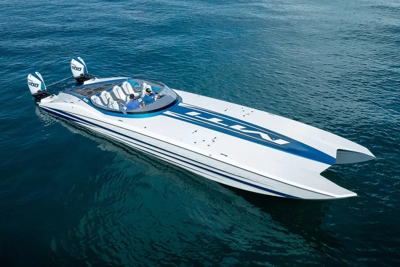  Yacht Photos Pics 2024 MTI 440X powerboat cruising on clear blue water.