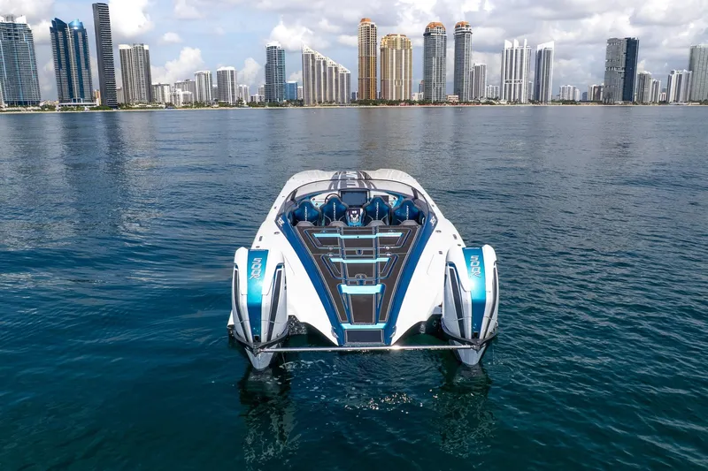  Yacht Photos Pics 2024 MTI 440X powerboat on water with city skyline in background.