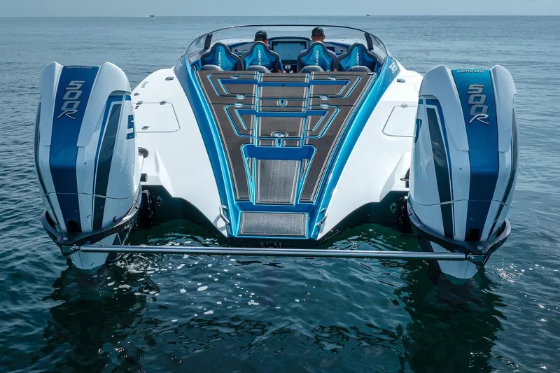  Yacht Photos Pics 2024 MTI 440X powerboat with dual Mercury 500R engines on calm water.