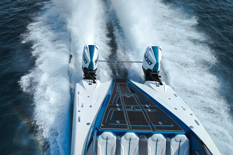  Yacht Photos Pics 2024 MTI 440X speedboat with dual engines cruising on open water.