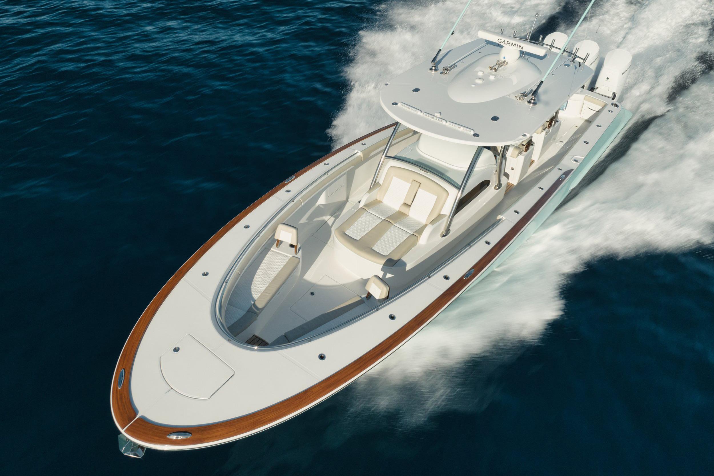 Manufacturer Provided Image: Mag Bay 43 CC cruising on open water, showcasing sleek design and luxury features.