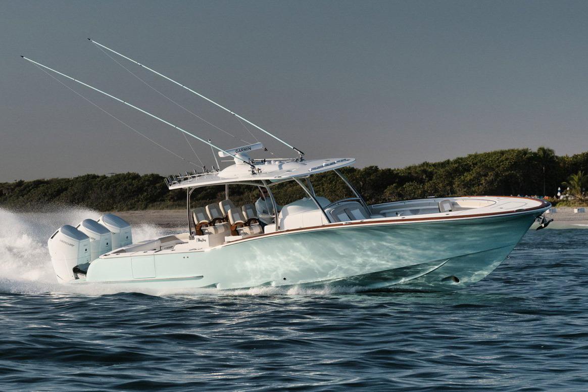 Manufacturer Provided Image: 2025 Mag Bay 43 CC boat cruising on water with triple outboard engines.