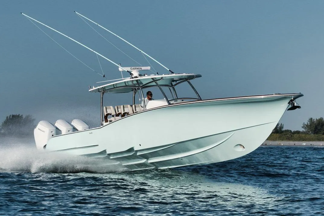 Manufacturer Provided Image: 2025 Mag Bay 43 CC boat cruising on open water, showcasing sleek design and powerful engines.