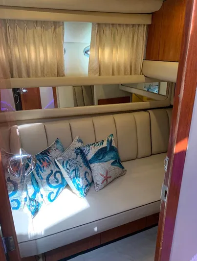  Yacht Photos Pics Interior of 2000 Sea Ray 480 Sedan Bridge with beige seating and decorative pillows.