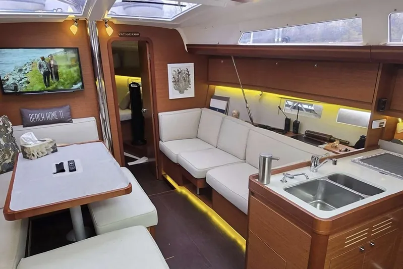  Yacht Photos Pics Luxurious interior of 2019 Dufour Grand Large 412 Grand Prix yacht with modern amenities.