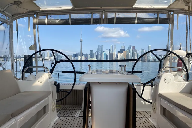  Yacht Photos Pics 2019 Dufour Grand Large 412 yacht with city skyline view in the background.
