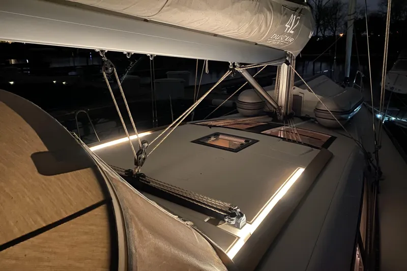  Yacht Photos Pics 2019 Dufour Grand Large 412 Grand Prix sailboat deck illuminated at night.