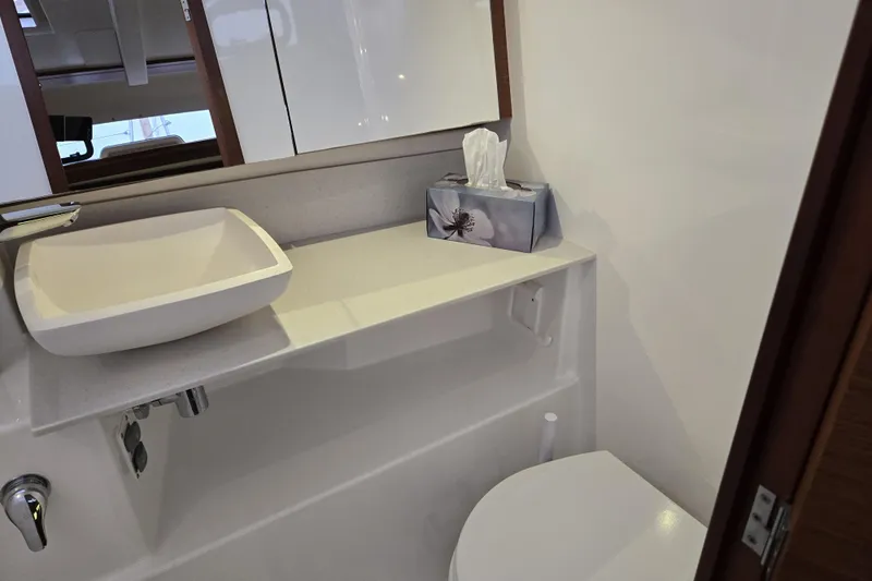  Yacht Photos Pics Bathroom interior of 2019 Dufour Grand Large 412 Grand Prix yacht.