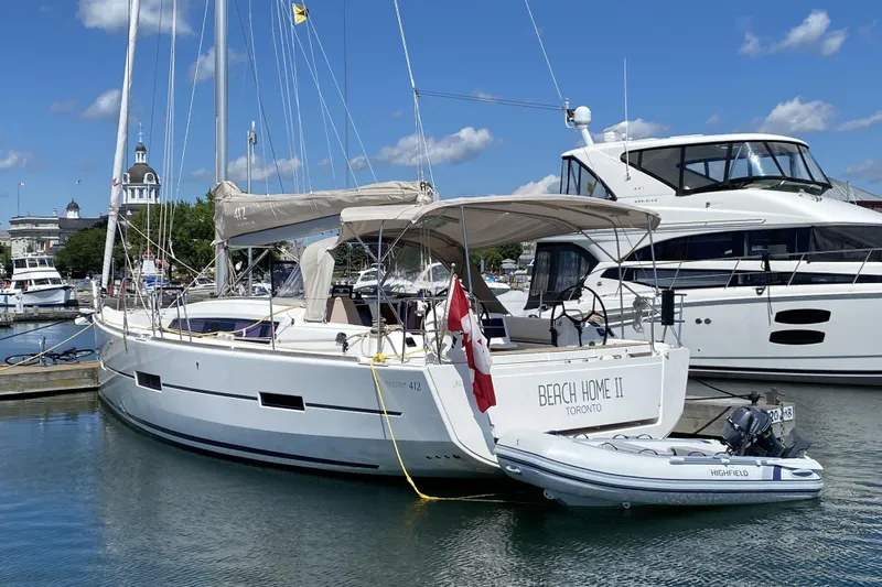  Yacht Photos Pics 2019 Dufour Grand Large 412 yacht docked at marina with Canadian flag.